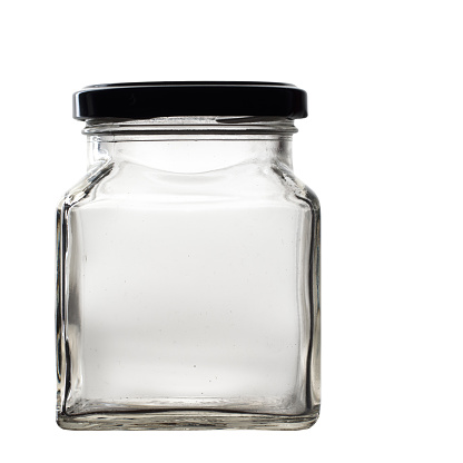 Mayonnaise in glass jar isolated on white background