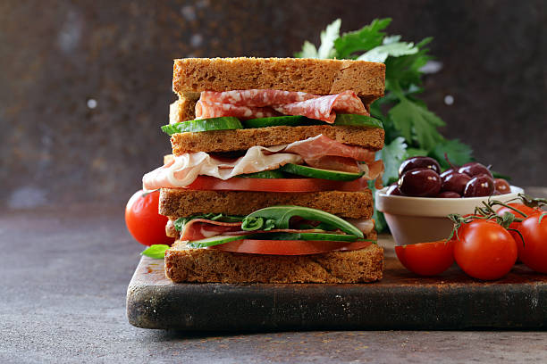 istock sandwich of rye bread with ham and vegetables 499281092