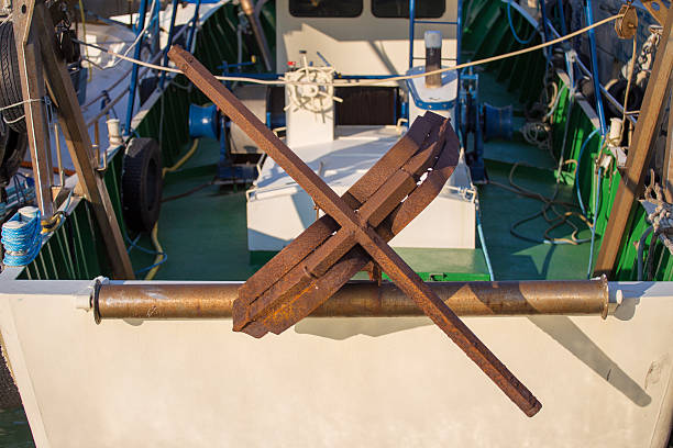 istock fishing boats in harbor - rusty anchor 499281615