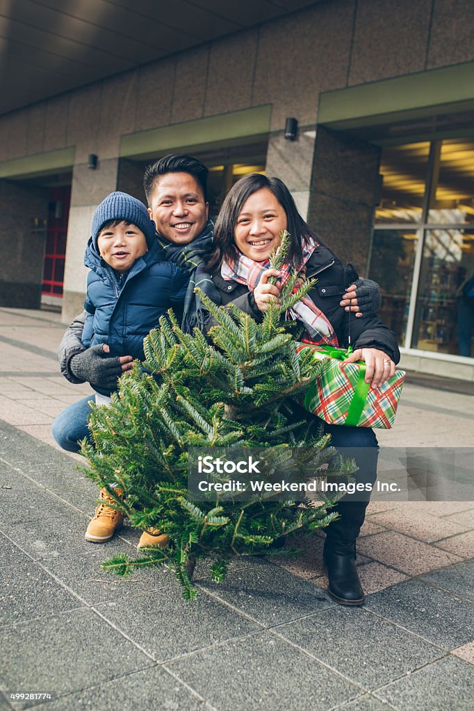 Christmas shopping Lovely family with Spruce tree and Christmas gifts 2015 Stock Photo