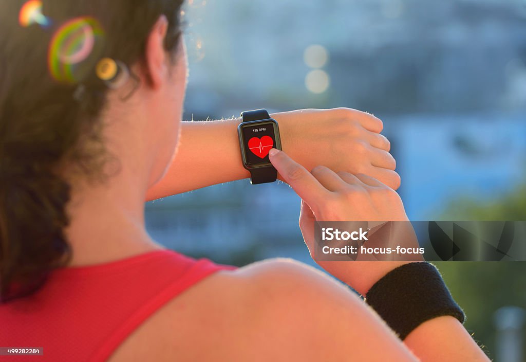 Wearable technology smart watch Woman using smart watch before exercising.  Healthy Lifestyle Stock Photo