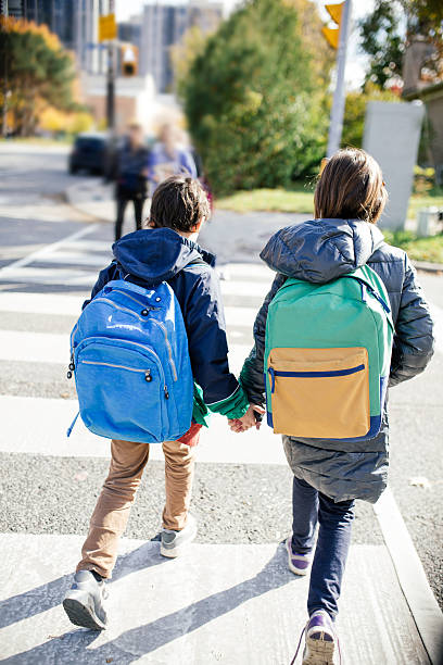 istock Student crossing the street 499283072