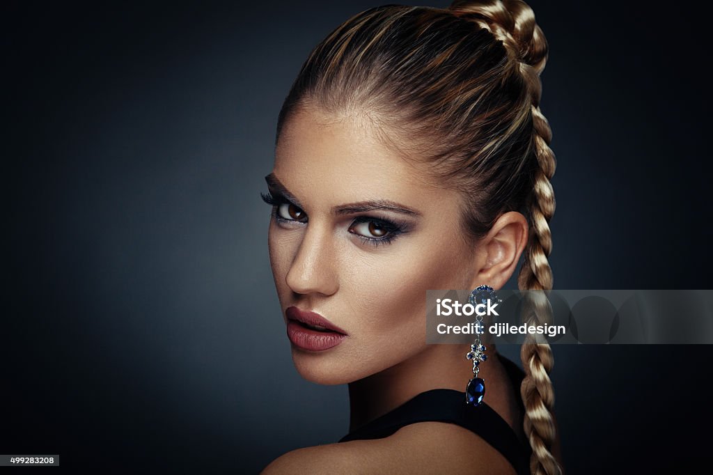 Beauty portrait of a young woman with braid hairstyle Ceremonial Make-Up Stock Photo