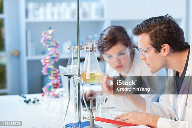 University Chemistry Laboratory Research Students Working In Class Together Stock Photo - Download Image Now