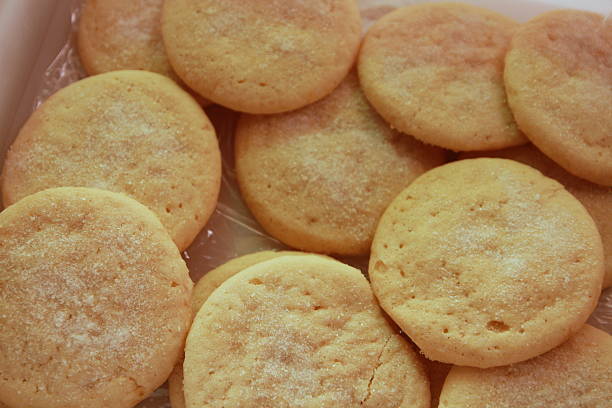 Unfrosted Sugar Cookies Up Close This pile of round, unfrosted sugar cookies reflects a productive baking day in an Iowa farm kitchen.  round sugar cookie stock pictures, royalty-free photos & images