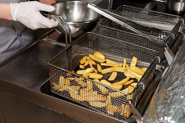 istock Chef is cooking french fries 499286286