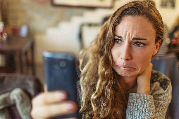 istock Young woman and her mobile phone 499288146