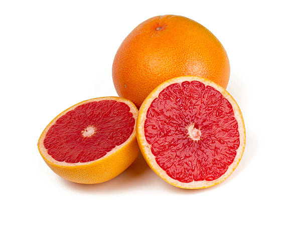 cut red grapefruit isolated on white stock photo