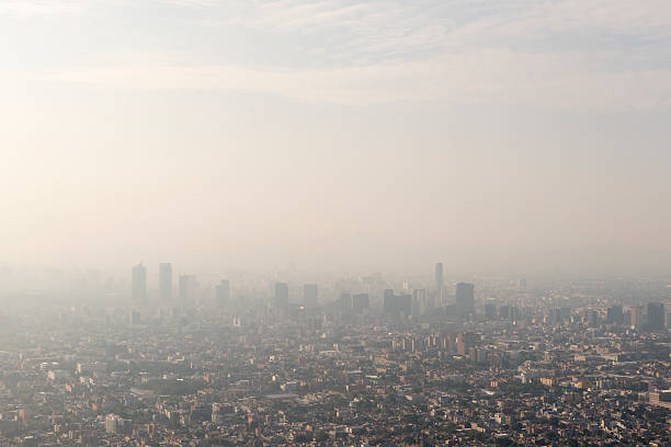 Mexico City skyline and smog Aerial view of skyline and smog Mexico City, Mexico pollution stock pictures, royalty-free photos & images