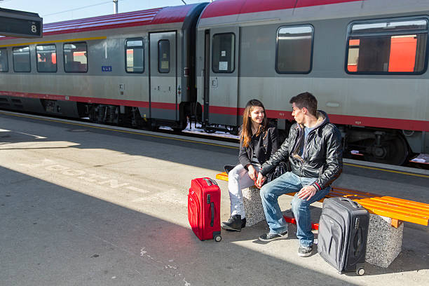 istock Young loving couple waiting for a train 499292752