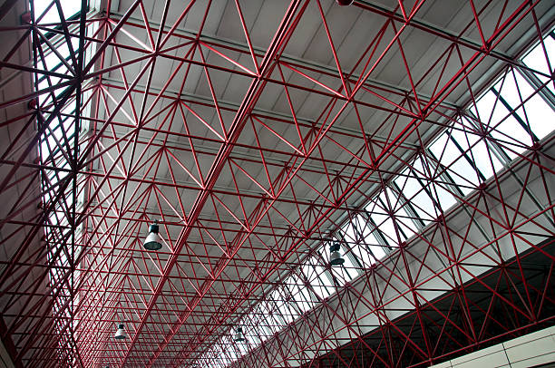 Modern interior architecture of metal steel roof structure of airport or industrial factory.