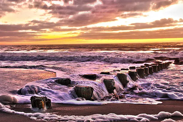 Photo of HDR Sunrise over the Atlantic Beach Landscape Sea foam  Pier