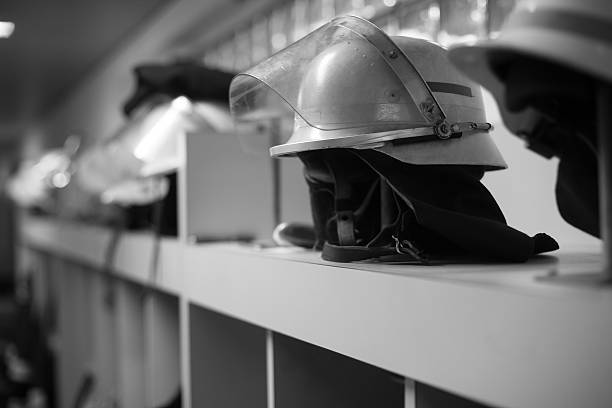 istock fire fighter helmets and work wear black white 499305304