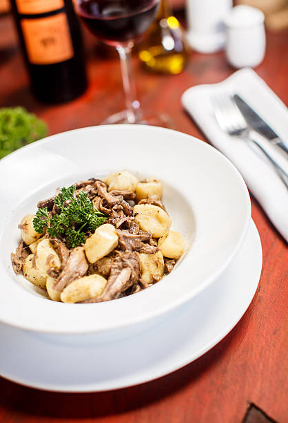 istock Traditional Italian dishes - gnocchi with duck 499305320