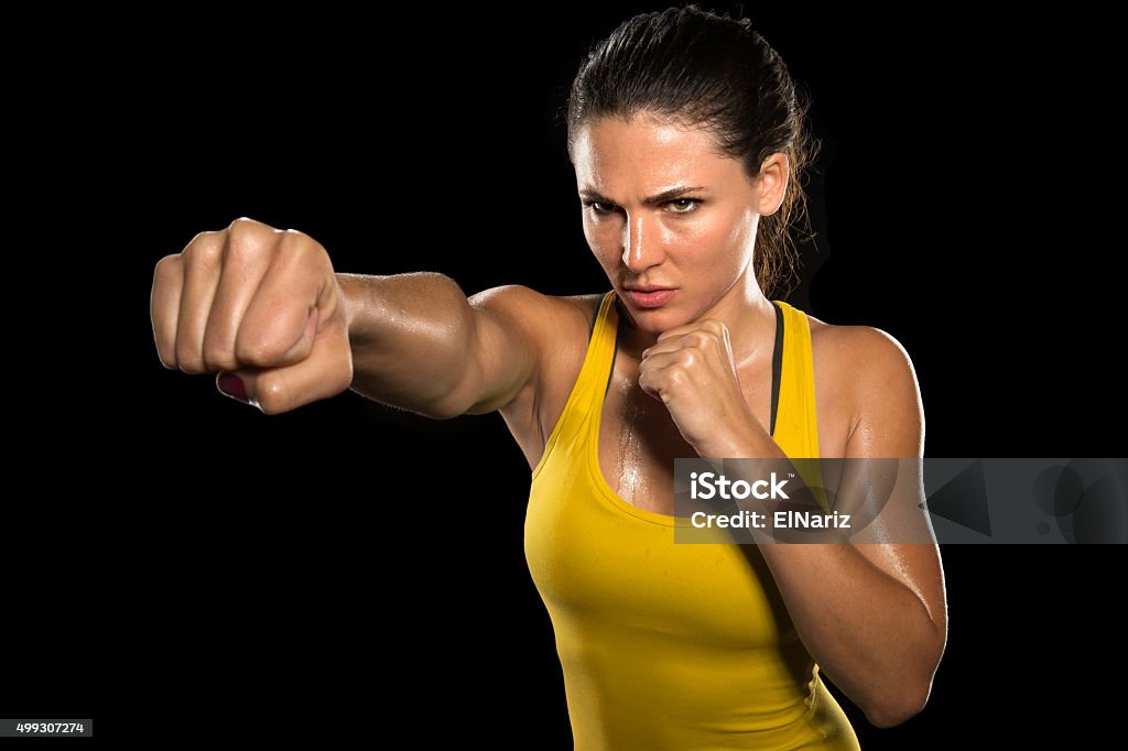 MMA woman fighter tough chick boxer punch pose exercise training Strong strength confidence power determination relentless conviction female athlete trainer conceptual Boxer fighter MMA tough woman athlete exercise training posing portrait champion intimidating fighter tough chick boxer punch pose pretty exercise training gym athlete Women Stock Photo