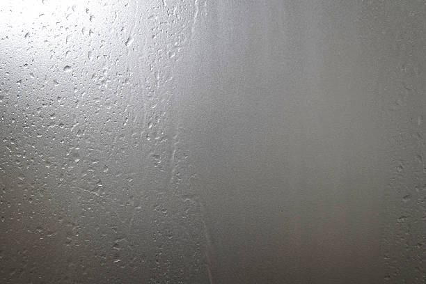 istock Frosted glass with water drops and bright light at corner 499309870