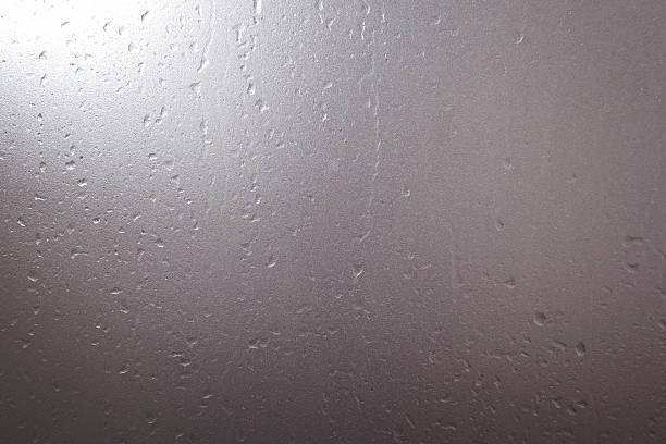 istock Frosted glass with water drops and bright light at corner 499309982