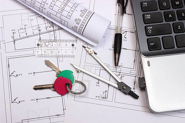 istock Electrical diagrams, accessories for drawing, home keys and laptop 499311818