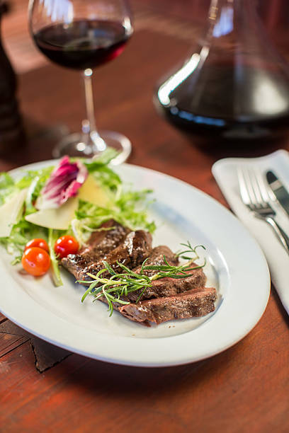 istock Steak with cheese and vegetables in a restaurant 499311842