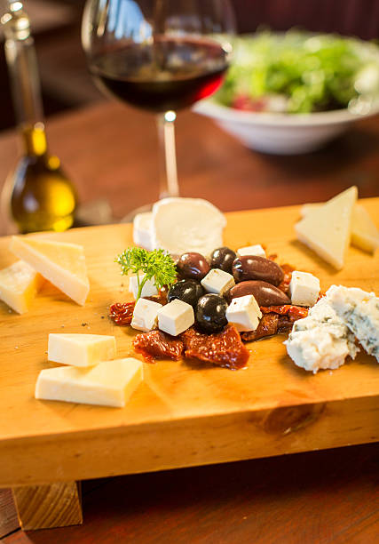 istock Cheese plate with a glass of red wine 499312224