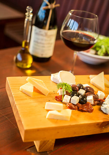 istock Cheese plate with a glass of red wine 499312234