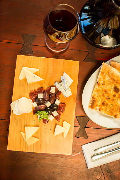 istock Cheese plate with a glass of red wine 499312372