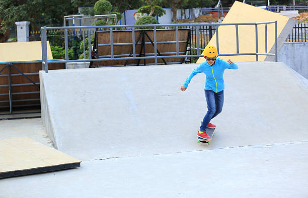 istock skateboarding woman at skatepark 499313020