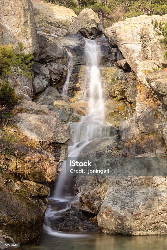 Waterfall of the English waterfall near Vizzavona in Corsica Slow shutter image of Cascade des Anglais waterfall cascading into crystal clear pool on the GR20 trail near Vizzavona in Corsica 2015 Stock Photo