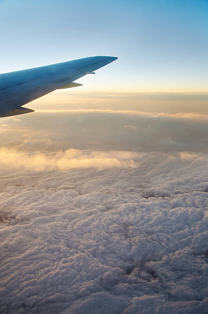 istock Wing aircraft at sunrise 499314518