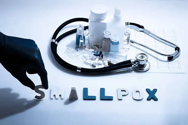 Diagnosis - Smallpox. Medical concept with pills, injection, stethoscope, cardiogram and a syringe