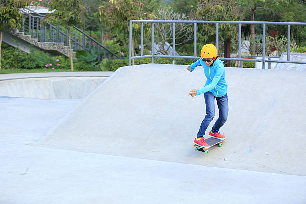 istock skateboarding woman at skatepark 499316408