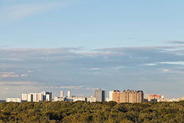 istock sunny summer twilight over city 499330237