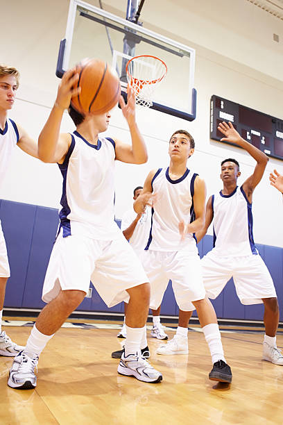 istock Male High School Basketball Team Playing Game 499330279