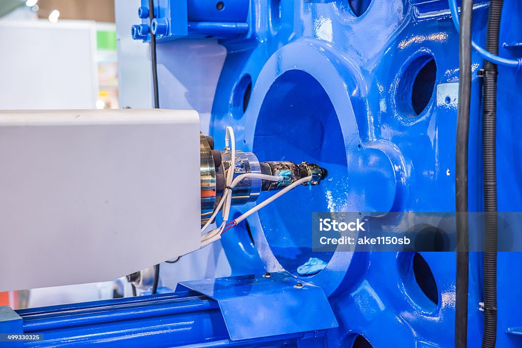 Metal screw components of the injection molding machine Molding a Shape Stock Photo