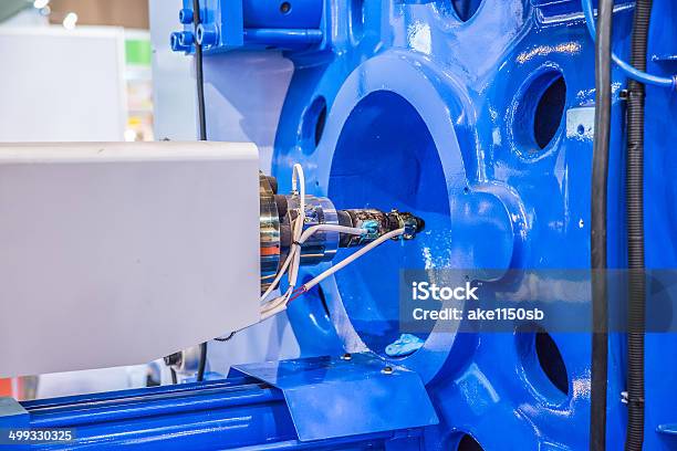 Metal Screw Components Of The Injection Molding Machine Stock Photo - Download Image Now