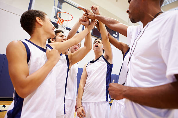 istock Male High School Basketball Team Having Team Talk With Coach 499330689