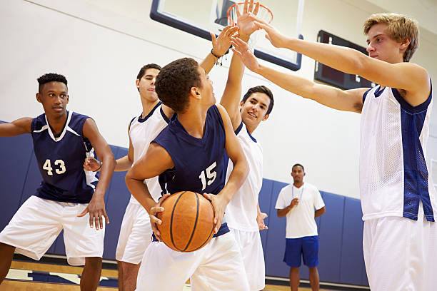 istock Male High School Basketball Team Playing Game 499331089