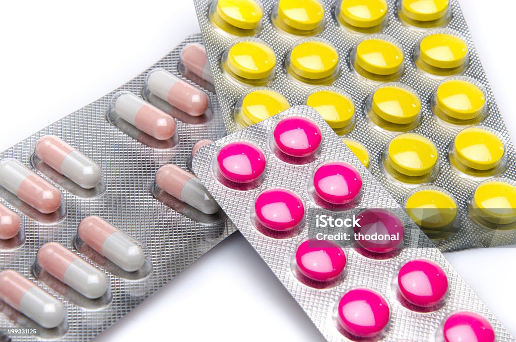 Pills and capsules in blister packs Pills and capsules in blister packs, isolated on white Addiction Stock Photo