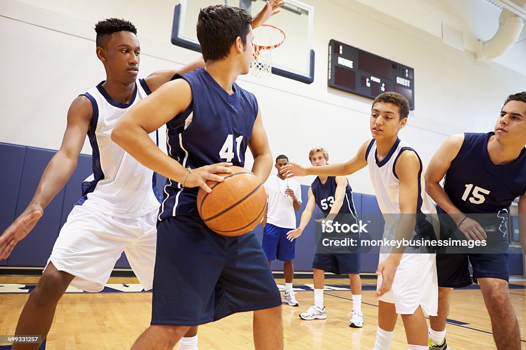 Male High School Basketball Team Playing Game Male High School Basketball Team Playing Game In Gymnasium Basketball - Sport Stock Photo