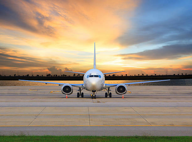 istock passenger jet plane parking in airport runways 499331567