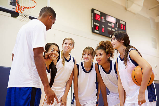 istock High School Basketball Team Having Team Talk With Coach 499331887