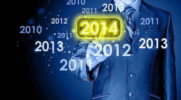 istock Businessman touching new year 2014 499333043