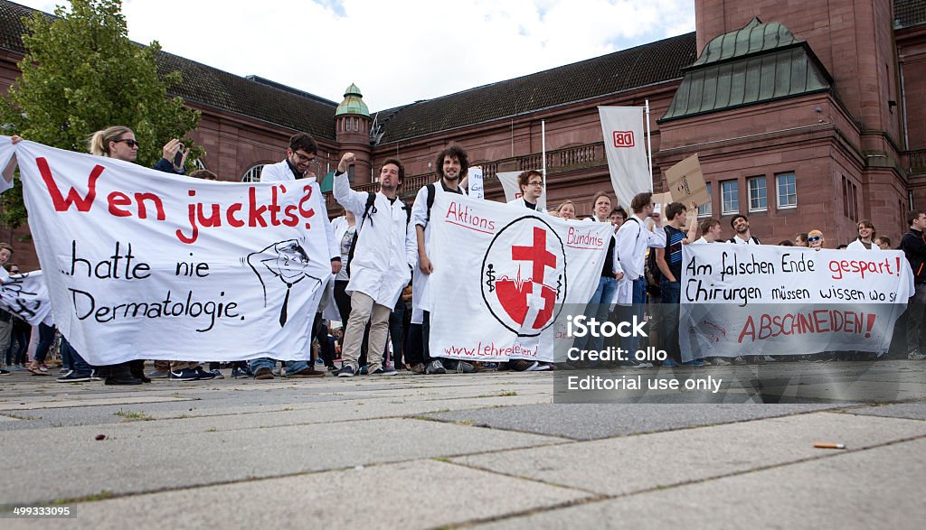 Education strike 2014 Wiesbaden, Germany - June 25, 2014: Young protestors during BILDUNGSSTREIK 2014-demonstration in the city center of Wiesbaden, holding up banners. The demonstration was - among others - organized by the Hessian student councils, one of the principal claims is to improve the quality of education and to stop the rising costs for students in Germany. Activist Stock Photo