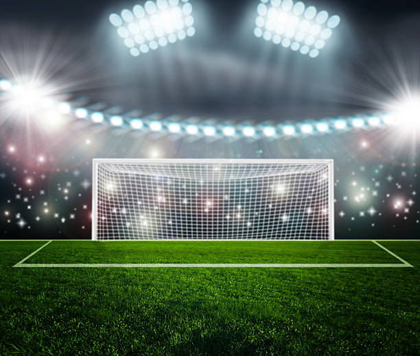 istock Soccer ball on green stadium arena 499333743