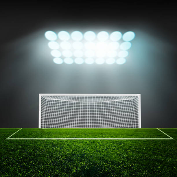 istock Soccer ball on green stadium arena 499333745