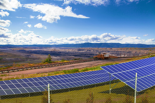 Coal mine with solar energy panels, landscape