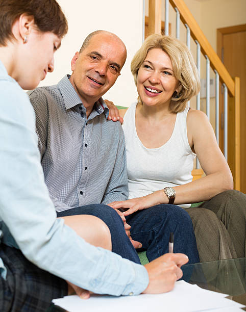 istock Mature couple filling questionnaire 499334195