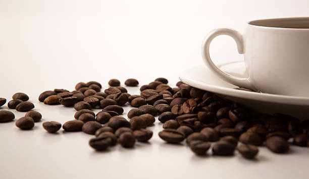 istock cup of black coffee with roasted coffe beans 499334301