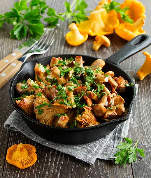 Fried chanterelle mushrooms in a creamy sauce