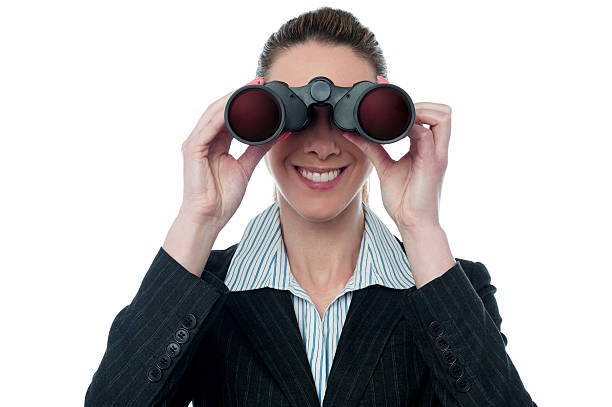 istock Businesswoman looking through binocular 499335045